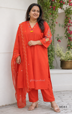 Bright orange cotton plus size churidar set with tassel V-neck, embroidered sleeve detail, matching bottom and dupatta.