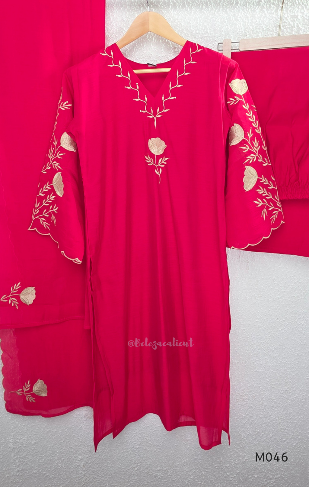 Bright rani red mul chanderi 3-piece churidar set with beige floral embroidery, scallop dupatta border and relaxed fit.