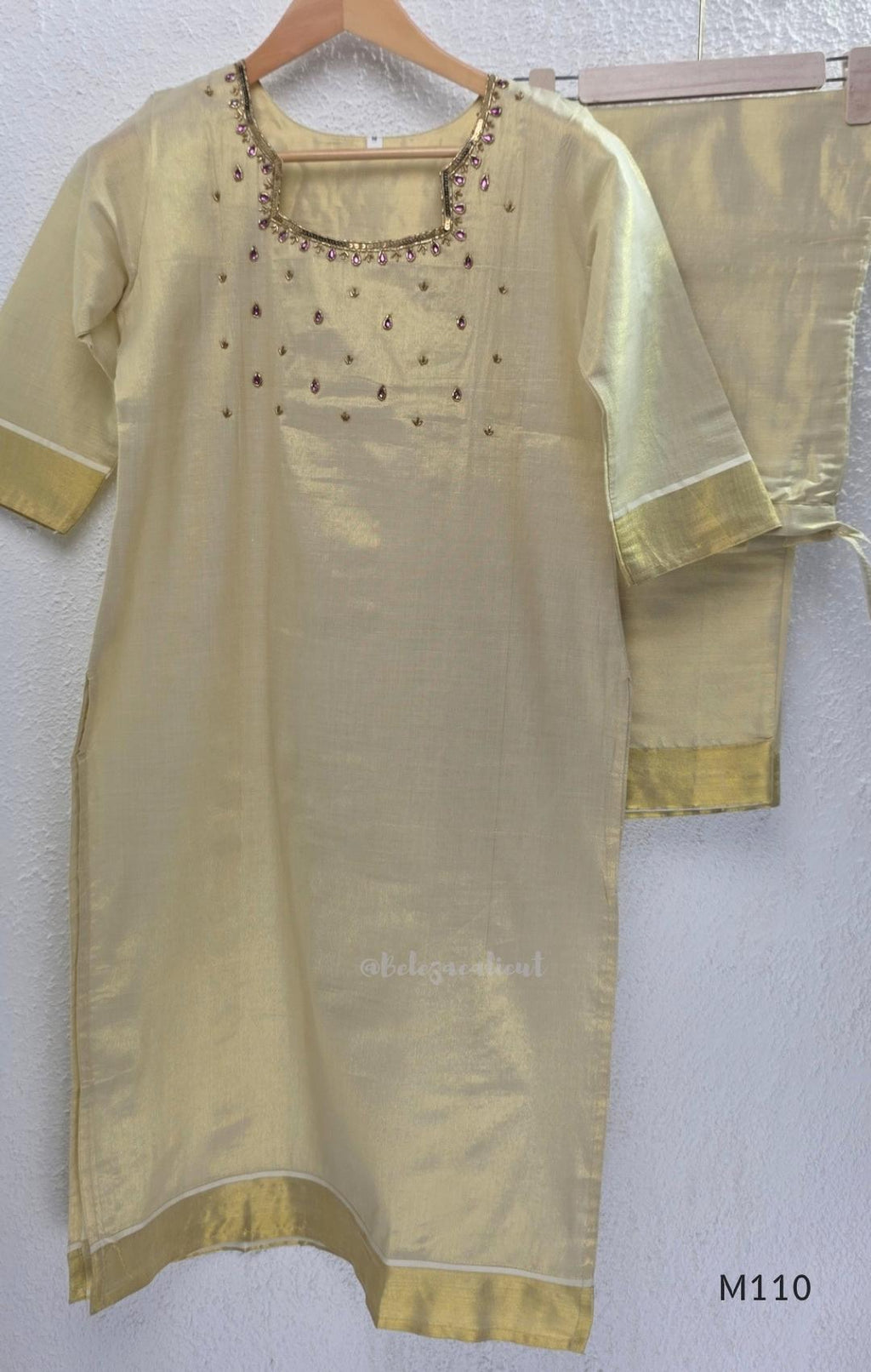 Champagne gold tissue silk 2-piece set with embellished neckline, elbow sleeves, straight kurta and matching bottom.