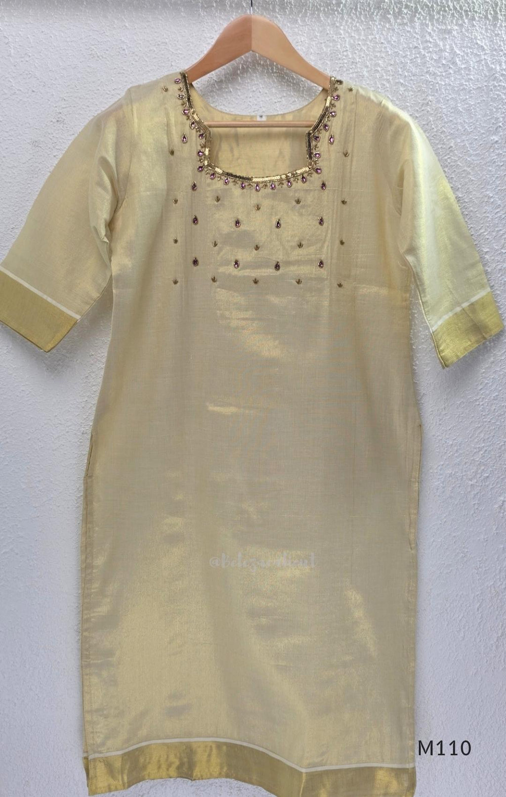 Champagne gold tissue silk 2-piece set with embellished neckline, elbow sleeves, straight kurta and matching bottom.