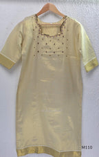 Champagne gold tissue silk 2-piece set with embellished neckline, elbow sleeves, straight kurta and matching bottom.