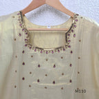 Champagne gold tissue silk 2-piece set with embellished neckline, elbow sleeves, straight kurta and matching bottom.