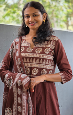 Chocolate brown Jaipur cotton 3-piece churidar set with cream horizontal band block print, mandala circular motifs, V-notch neckline, A-line flared kurti with 3/4 sleeves and border hem, matching block print dupatta, Indian ethnic wear from Beleza Calicut