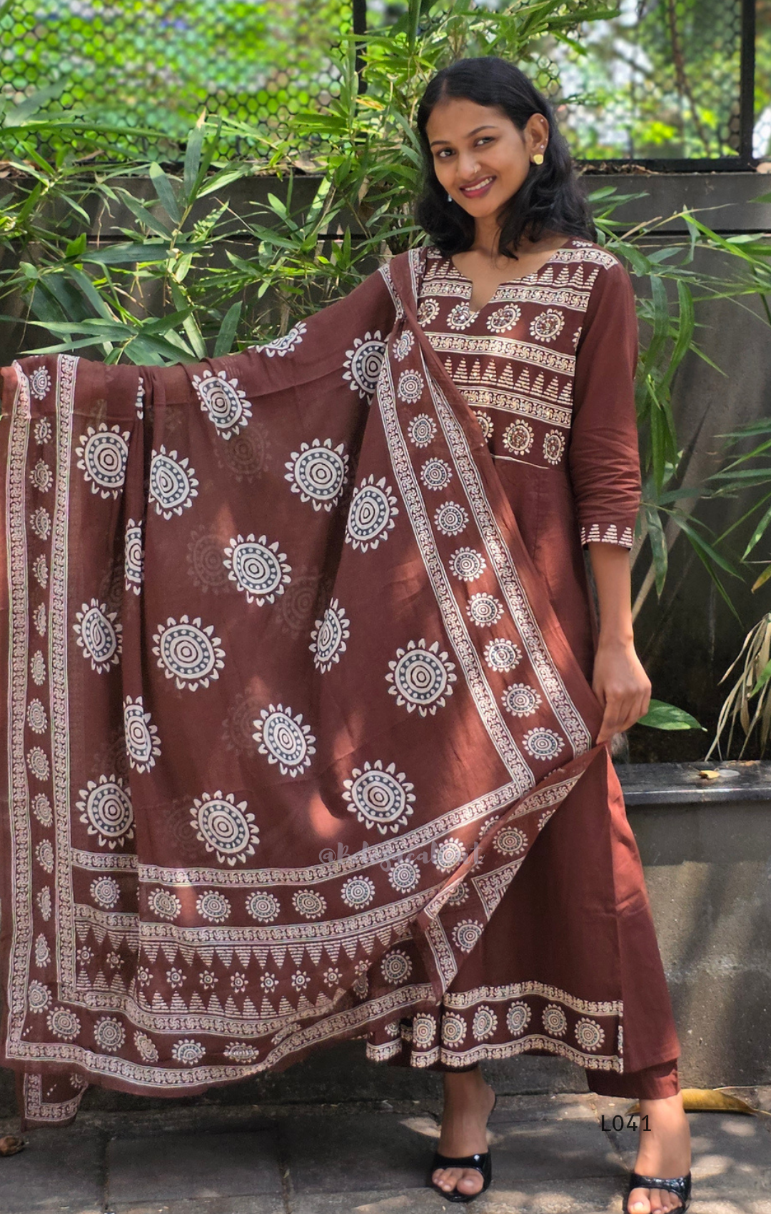 Chocolate brown Jaipur cotton 3-piece churidar set with cream horizontal band block print, mandala circular motifs, V-notch neckline, A-line flared kurti with 3/4 sleeves and border hem, matching block print dupatta, Indian ethnic wear from Beleza Calicut