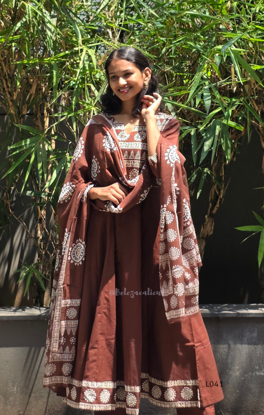 Chocolate brown Jaipur cotton 3-piece churidar set with cream horizontal band block print, mandala circular motifs, V-notch neckline, A-line flared kurti with 3/4 sleeves and border hem, matching block print dupatta, Indian ethnic wear from Beleza Calicut