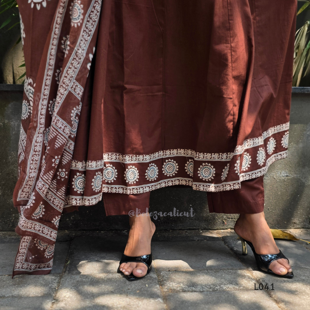 Chocolate brown Jaipur cotton 3-piece churidar set with cream horizontal band block print, mandala circular motifs, V-notch neckline, A-line flared kurti with 3/4 sleeves and border hem, matching block print dupatta, Indian ethnic wear from Beleza Calicut