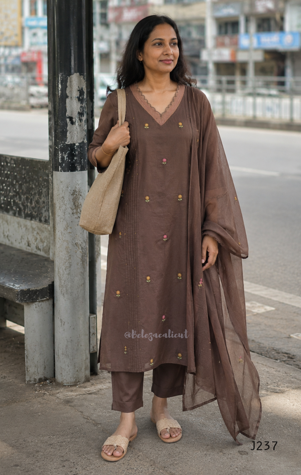 Coffee brown mul cotton churidar set with lining, floral embroidery, dupatta and scallop neckline. Available at Beleza Calicut.
