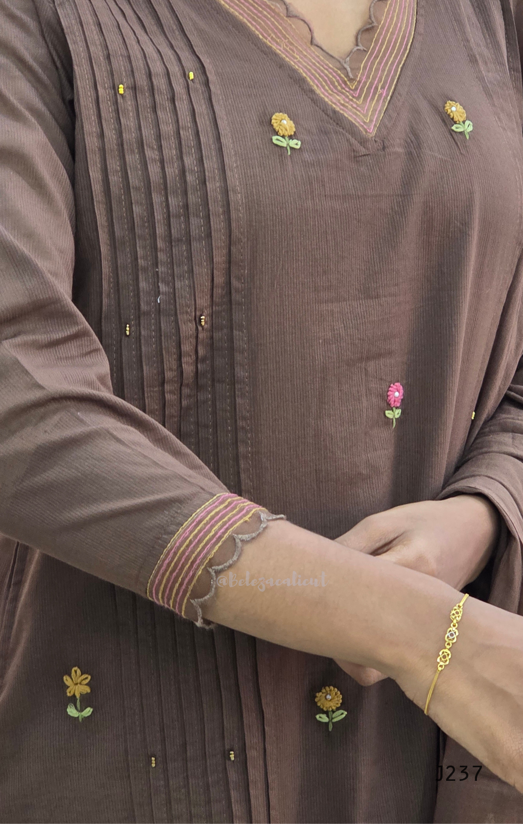 Coffee brown mul cotton churidar set with lining, floral embroidery, dupatta and scallop neckline. Available at Beleza Calicut.