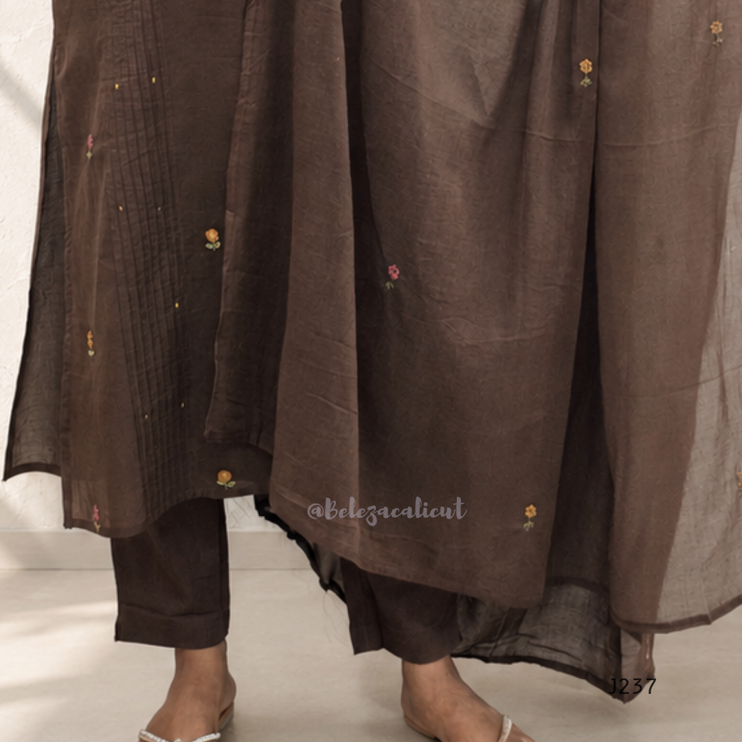 Coffee brown mul cotton churidar set with lining, floral embroidery, dupatta and scallop neckline. Available at Beleza Calicut.