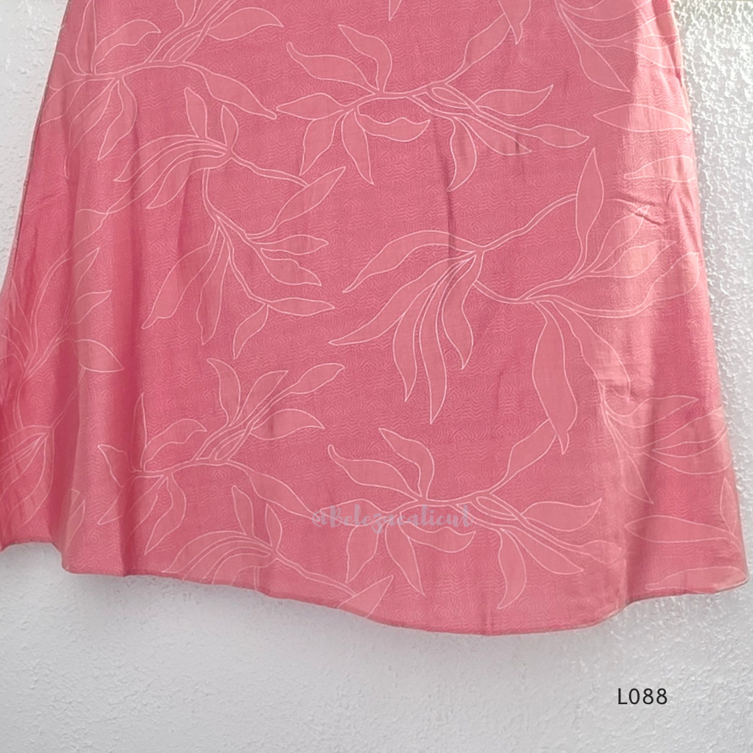 Coral pink rayon blend 2-piece set with white leaf line print, high neck top, back zip and matching printed straight pant.