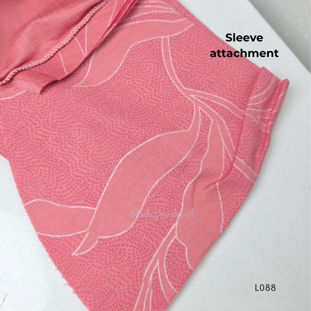 Coral pink rayon blend 2-piece set with white leaf line print, high neck top, back zip and matching printed straight pant.