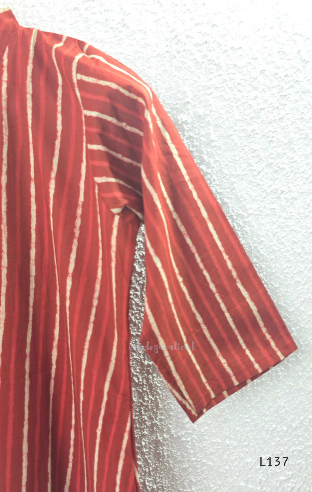 Cotton women’s ethnic top in stripe and floral print patterns with V-neck, straight fit, and everyday kurti-style design.