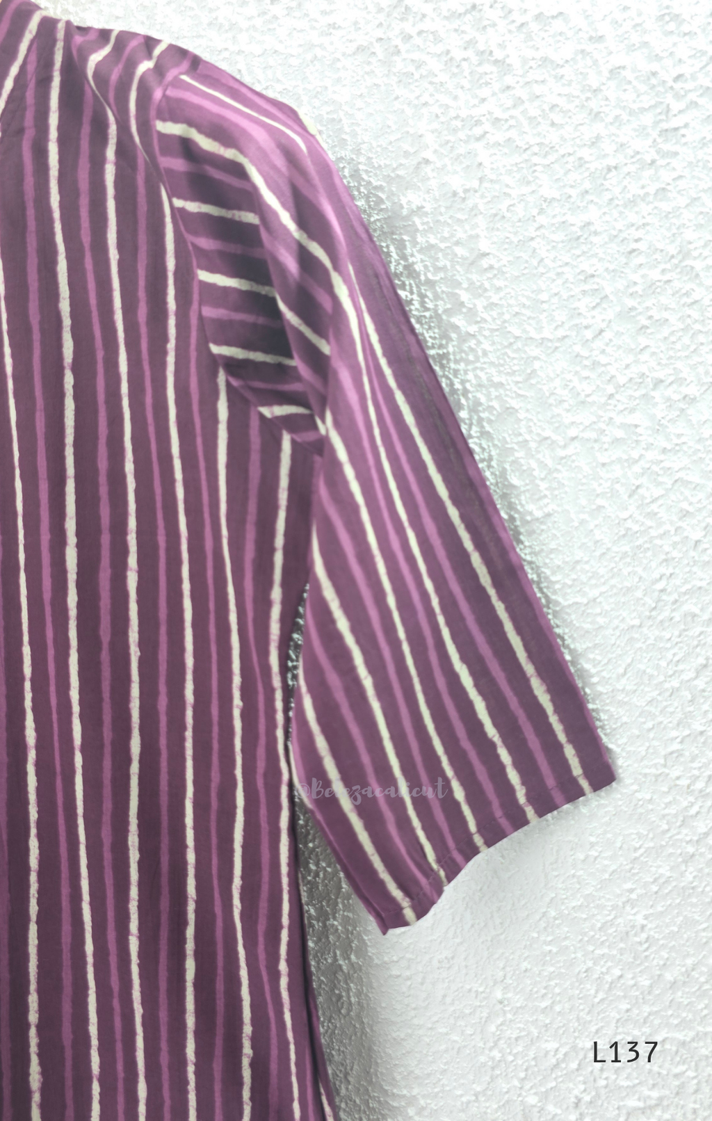 Cotton women’s ethnic top in stripe and floral print patterns with V-neck, straight fit, and everyday kurti-style design.