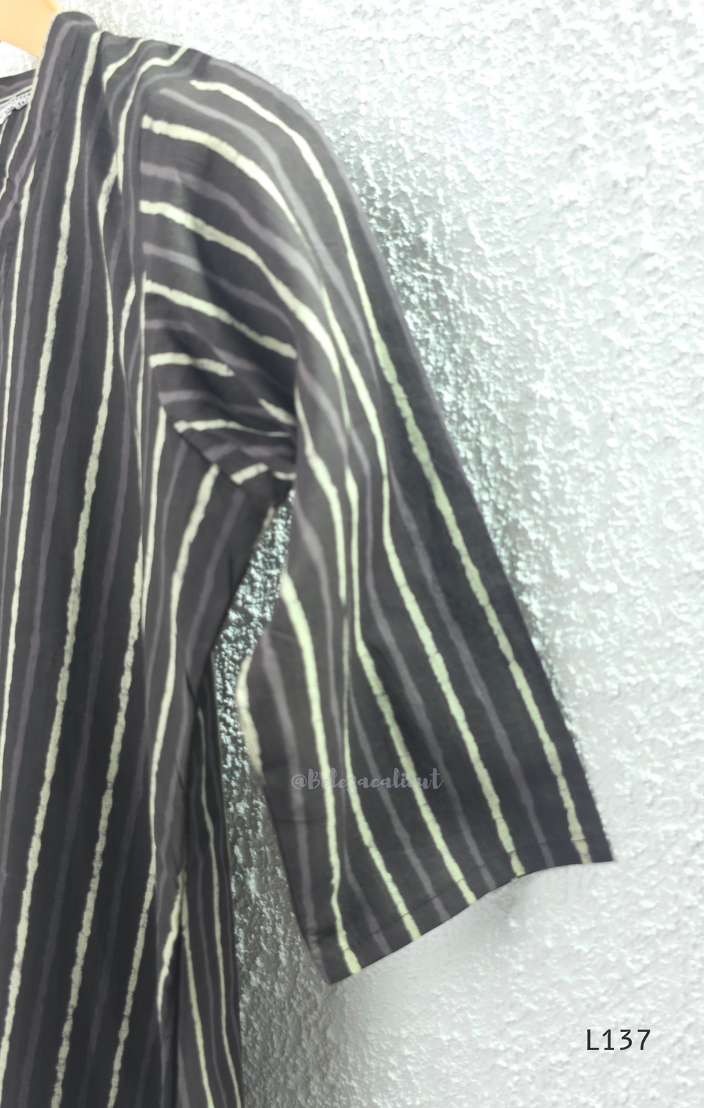 Cotton women’s ethnic top in stripe and floral print patterns with V-neck, straight fit, and everyday kurti-style design.