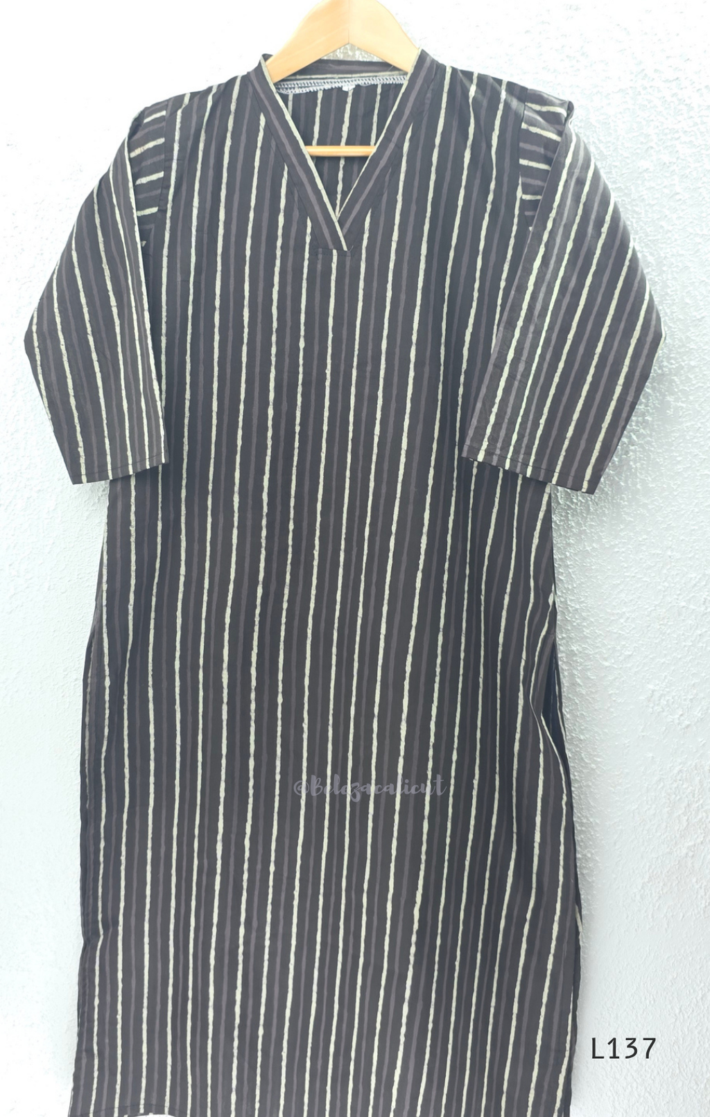 Cotton women’s ethnic top in stripe and floral print patterns with V-neck, straight fit, and everyday kurti-style design.