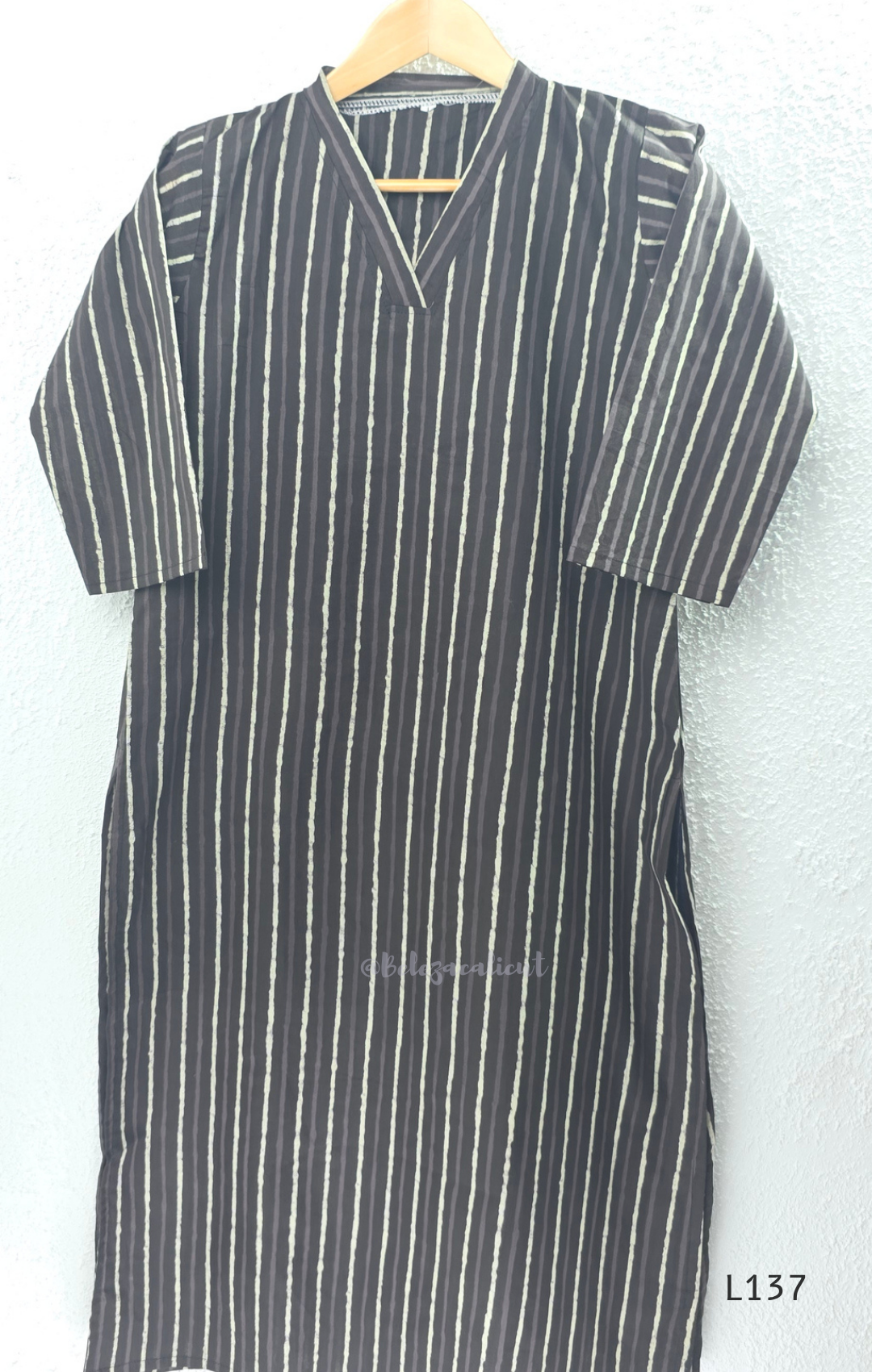 Cotton women’s ethnic top in stripe and floral print patterns with V-neck, straight fit, and everyday kurti-style design.