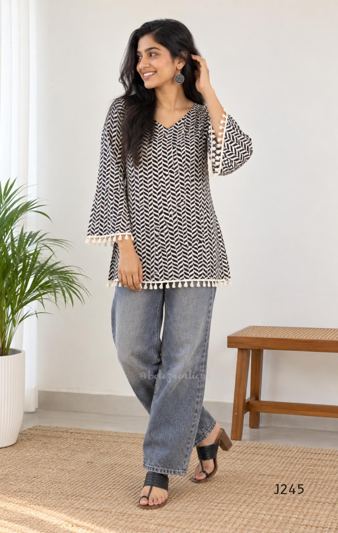 Cream cotton printed short top with bell sleeves and tassel edging, sold as a top only.