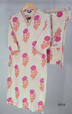 Cream flex cotton top and straight-pant co-ord set with bright pink and orange floral motifs and decorative neckline trim.