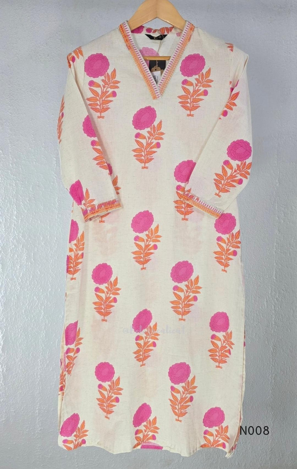 Cream flex cotton top and straight-pant co-ord set with bright pink and orange floral motifs and decorative neckline trim.