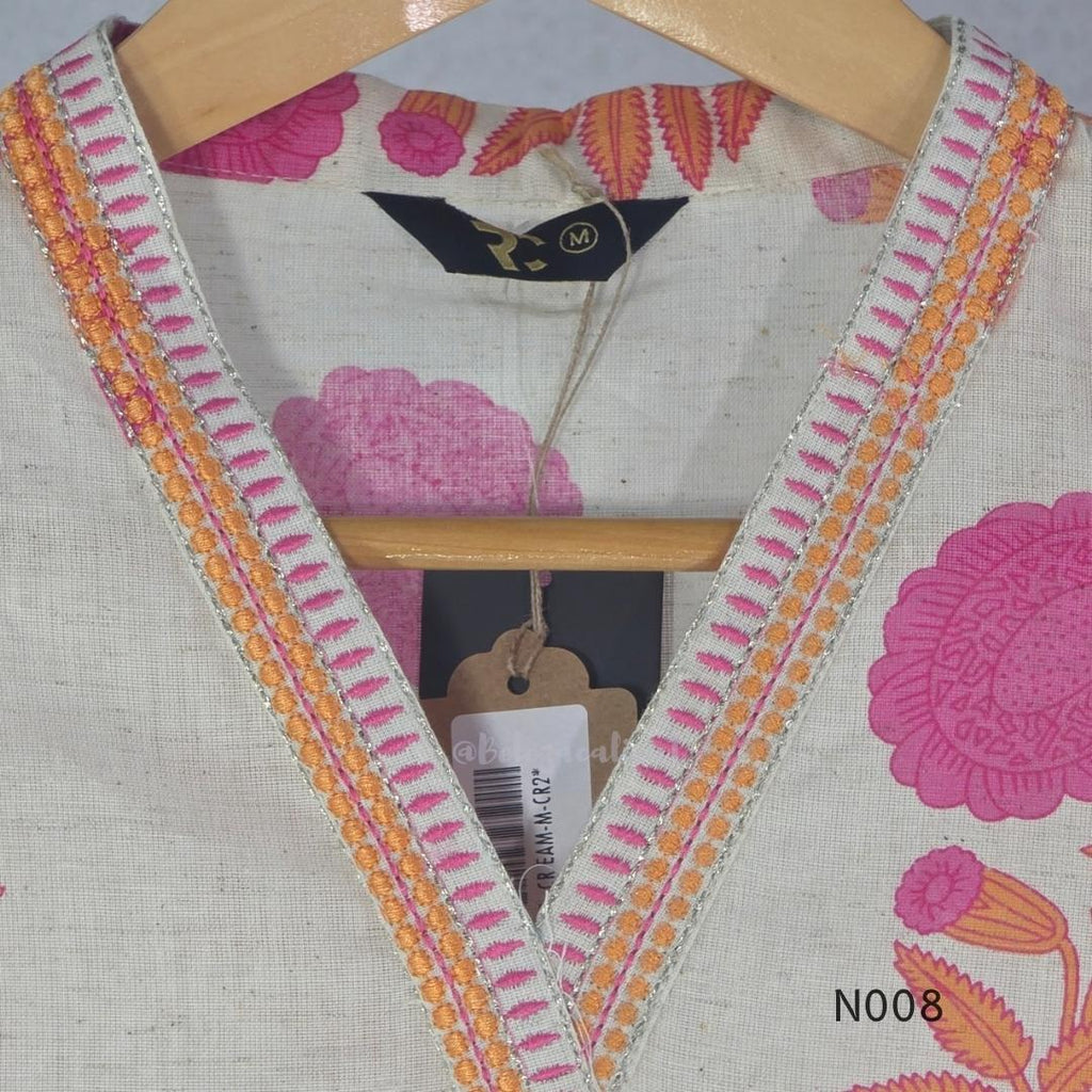 Cream flex cotton top and straight-pant co-ord set with bright pink and orange floral motifs and decorative neckline trim.