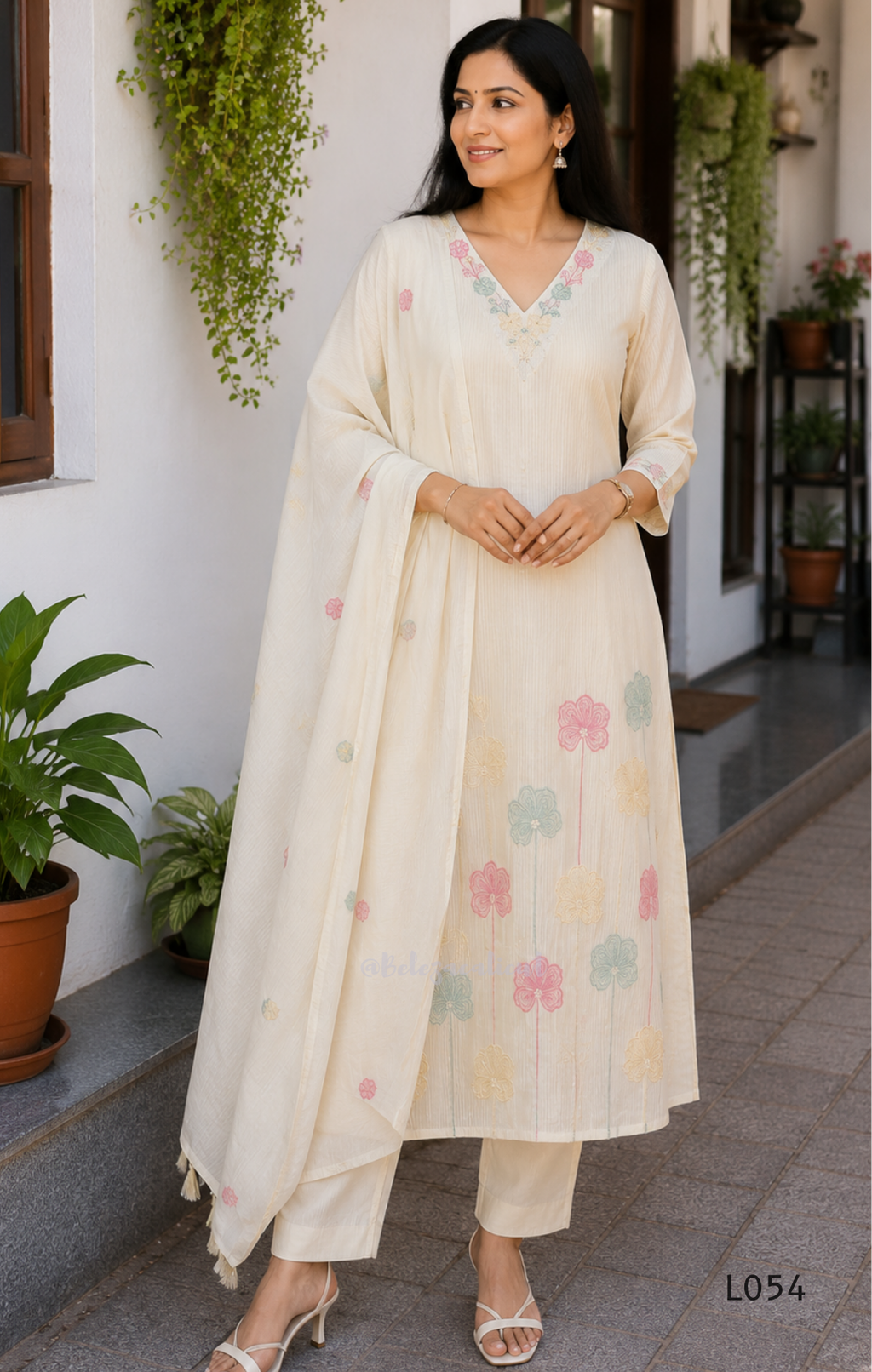 Cream mul cotton churidar set with lining, pastel pink and powder blue floral embroidery, matching dupatta, 3/4 sleeves and V-neck bead detail 