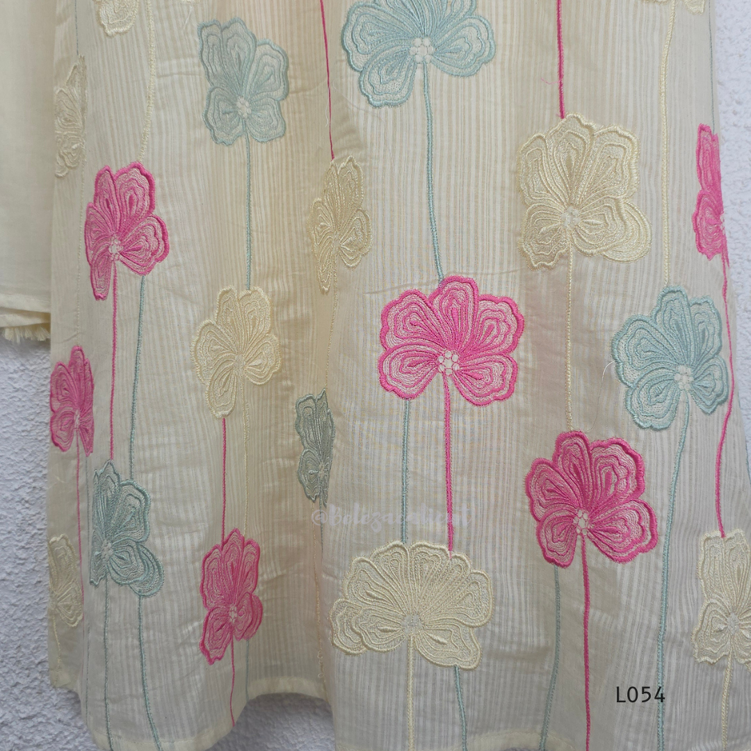 Cream mul cotton churidar set with lining, pastel pink and powder blue floral embroidery, matching dupatta, 3/4 sleeves and V-neck bead detail 