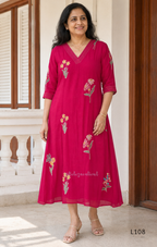 Deep magenta mul chanderi A-line kurti with colourful floral embroidery, V-neck stitch detail and 3/4 sleeves
