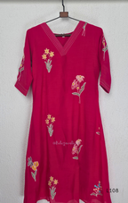 Deep magenta mul chanderi A-line kurti with colourful floral embroidery, V-neck stitch detail and 3/4 sleeves