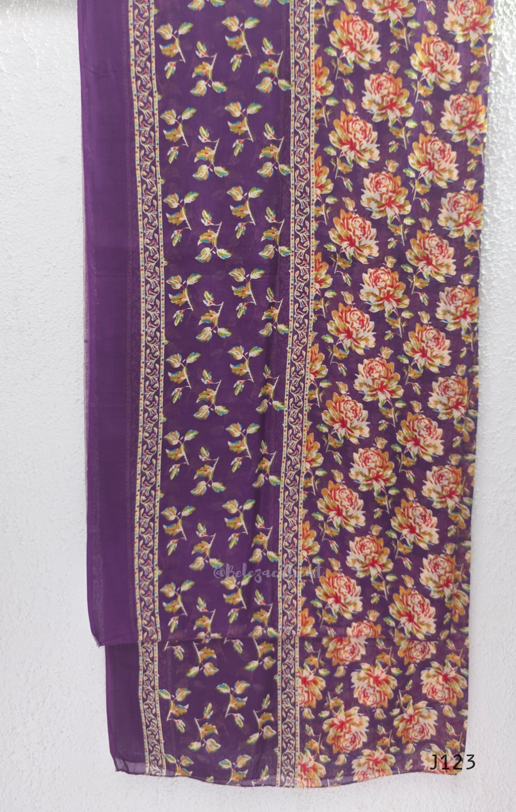 Purple Jaipur cotton churidar set with floral print, V-neck detail, matching printed bottom and dupatta.