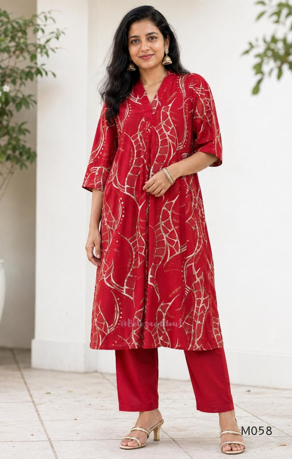 Deep red silk blend 2-piece set with cream and taupe abstract printed A-line top and matching plain red ankle-length pant.