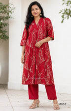 Deep red silk blend 2-piece set with cream and taupe abstract printed A-line top and matching plain red ankle-length pant.