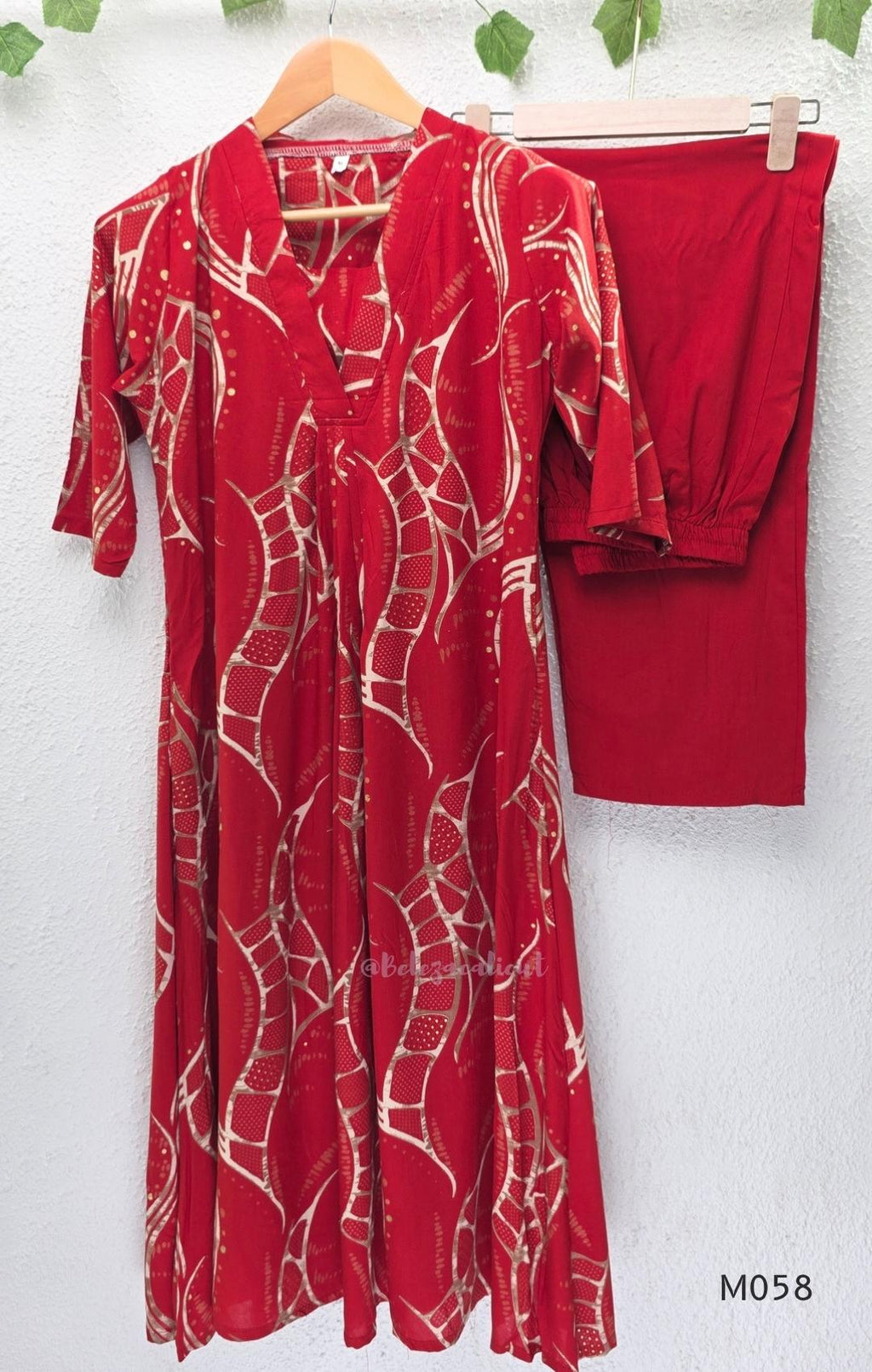 Deep red silk blend 2-piece set with cream and taupe abstract printed A-line top and matching plain red ankle-length pant.