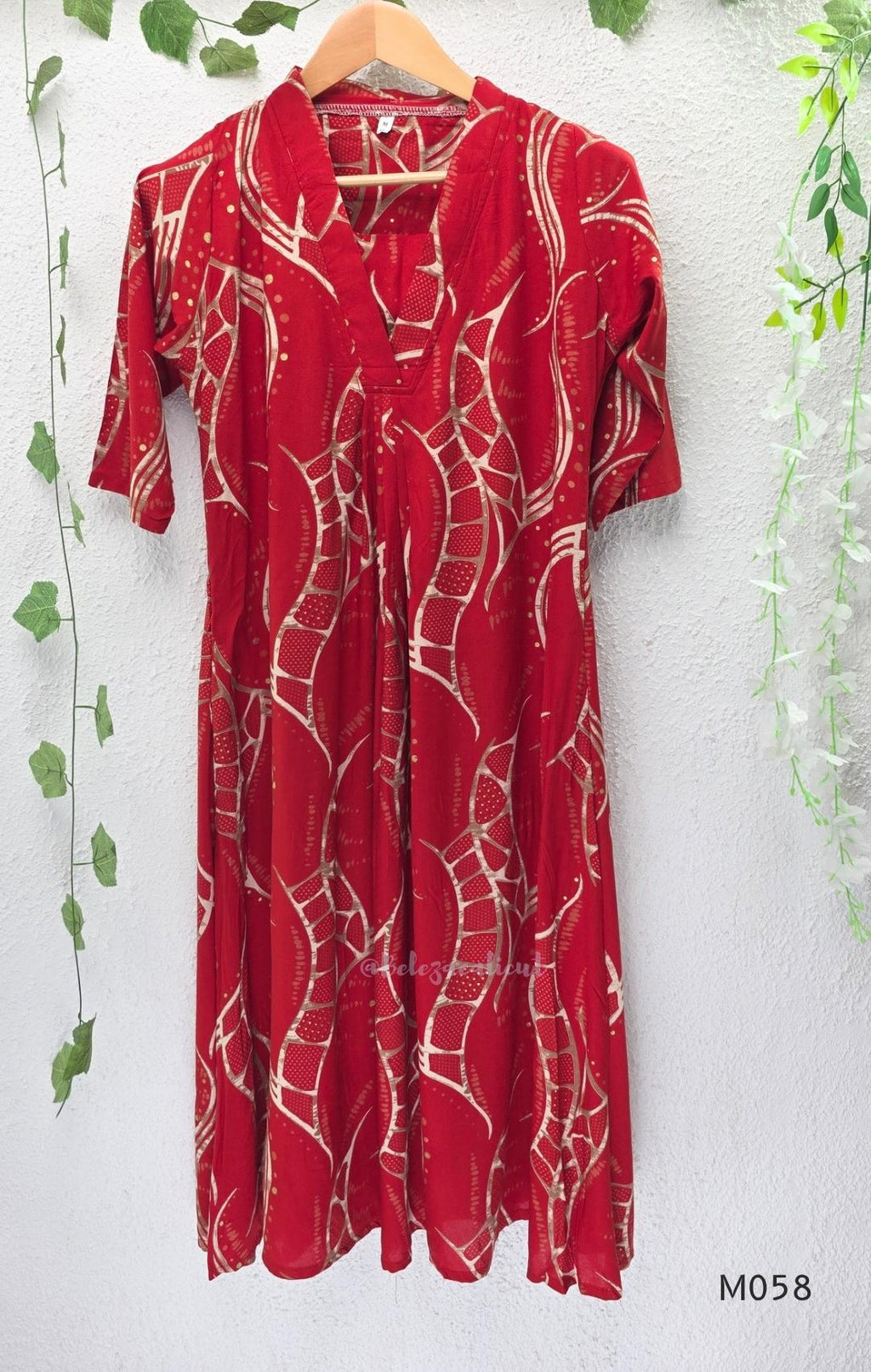 Deep red silk blend 2-piece set with cream and taupe abstract printed A-line top and matching plain red ankle-length pant.