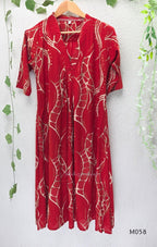 Deep red silk blend 2-piece set with cream and taupe abstract printed A-line top and matching plain red ankle-length pant.