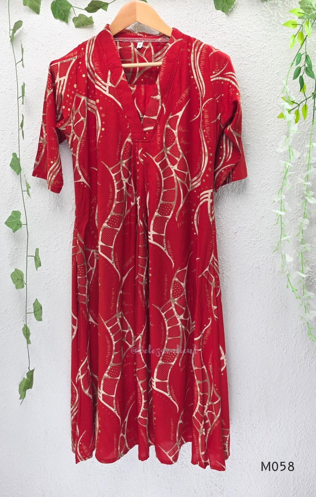 Deep red silk blend 2-piece set with cream and taupe abstract printed A-line top and matching plain red ankle-length pant.