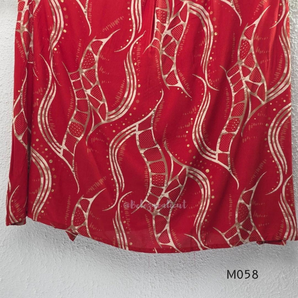 Deep red silk blend 2-piece set with cream and taupe abstract printed A-line top and matching plain red ankle-length pant.