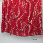 Deep red silk blend 2-piece set with cream and taupe abstract printed A-line top and matching plain red ankle-length pant.