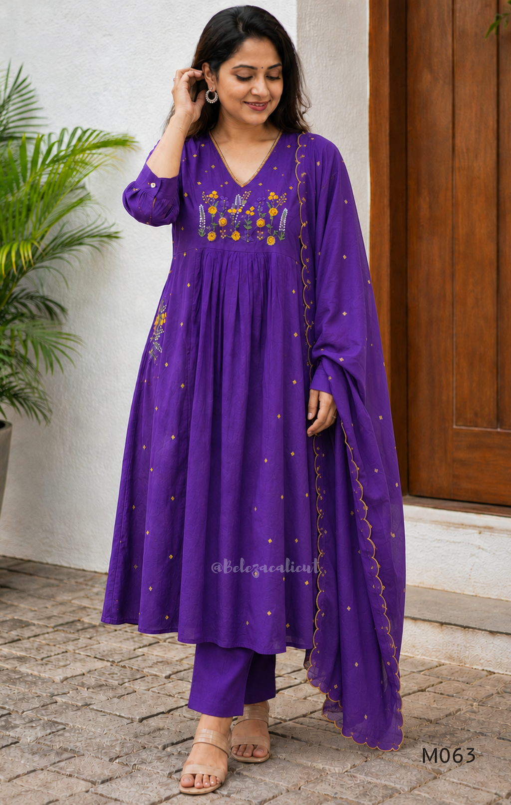 Purple cotton 3-piece churidar set with yellow floral embroidery, V-neck, matching dupatta and plain bottom.