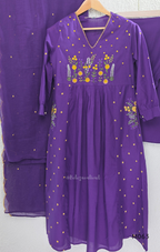 Purple cotton 3-piece churidar set with yellow floral embroidery, V-neck, matching dupatta and plain bottom.