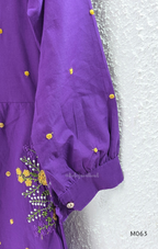 Purple cotton 3-piece churidar set with yellow floral embroidery, V-neck, matching dupatta and plain bottom.