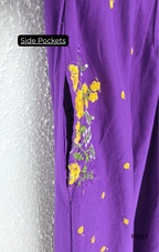 Purple cotton 3-piece churidar set with yellow floral embroidery, V-neck, matching dupatta and plain bottom.