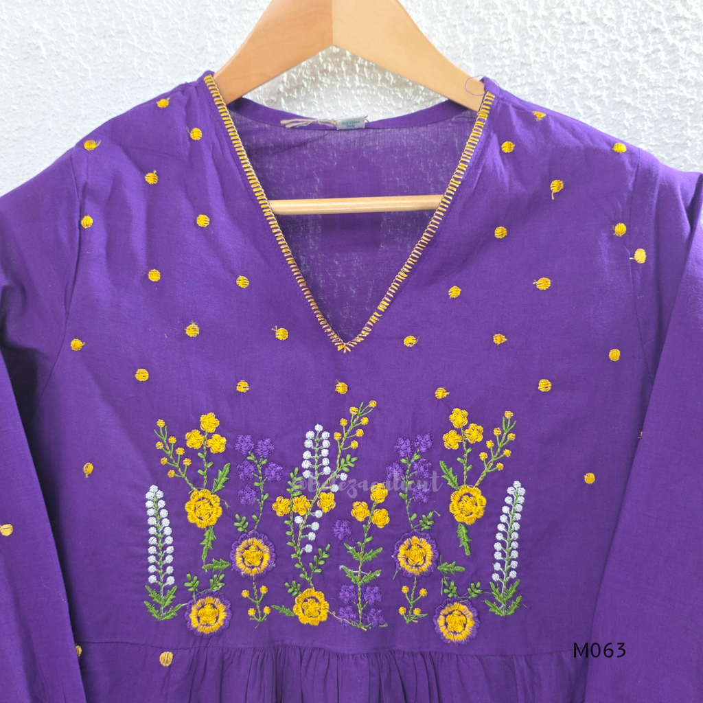 Purple cotton 3-piece churidar set with yellow floral embroidery, V-neck, matching dupatta and plain bottom.