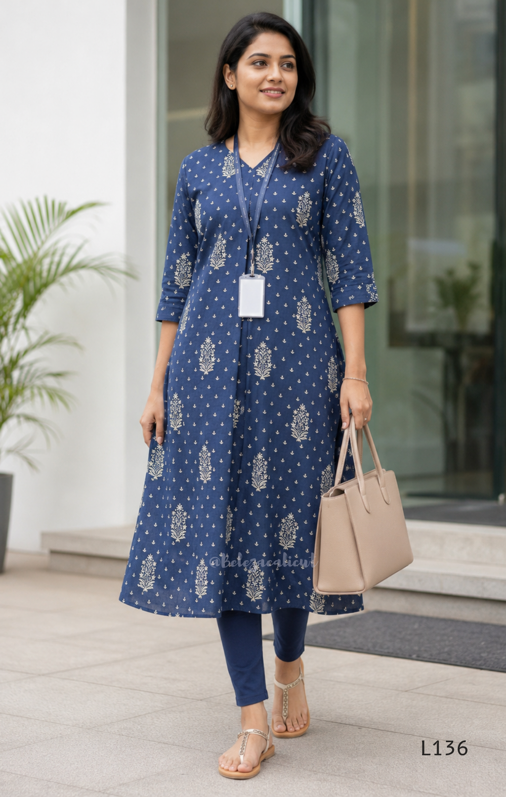 Dusty blue cotton kurta top with white floral buti print, centre pleat detail, 3/4 sleeves, and relaxed A-line fit.