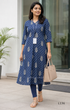 Dusty blue cotton kurta top with white floral buti print, centre pleat detail, 3/4 sleeves, and relaxed A-line fit.