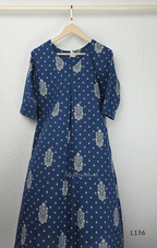 Dusty blue cotton kurta top with white floral buti print, centre pleat detail, 3/4 sleeves, and relaxed A-line fit.