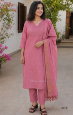 Dusty rose cotton lined 3-piece ethnic set with V-neck pintuck yoke, matching pant and textured tassel dupatta.