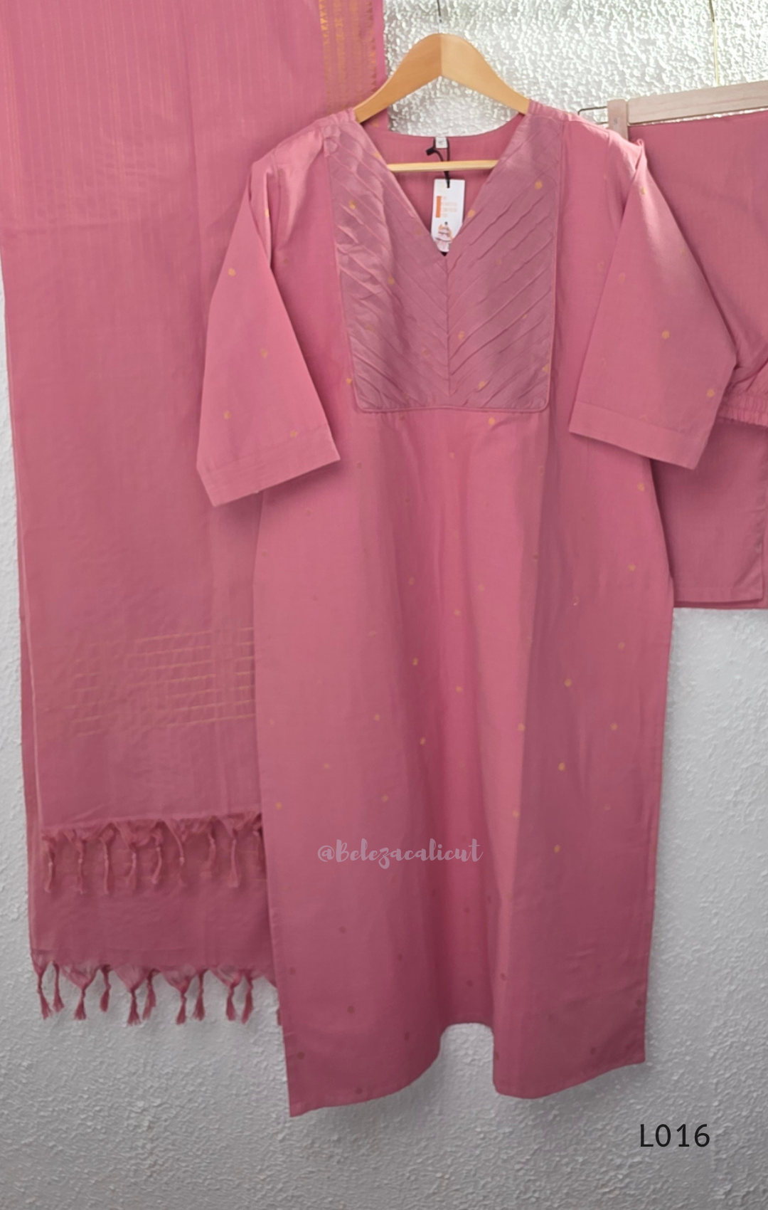 Dusty rose cotton lined 3-piece ethnic set with V-neck pintuck yoke, matching pant and textured tassel dupatta.
