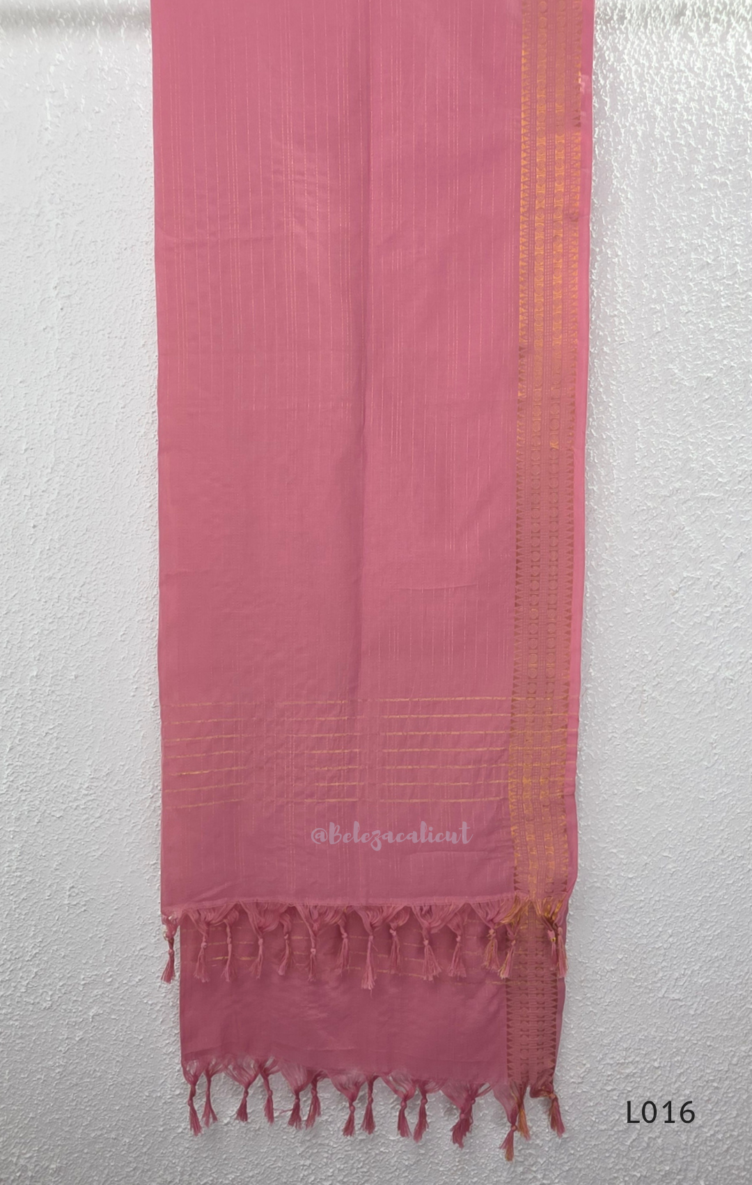 Dusty rose cotton lined 3-piece ethnic set with V-neck pintuck yoke, matching pant and textured tassel dupatta.