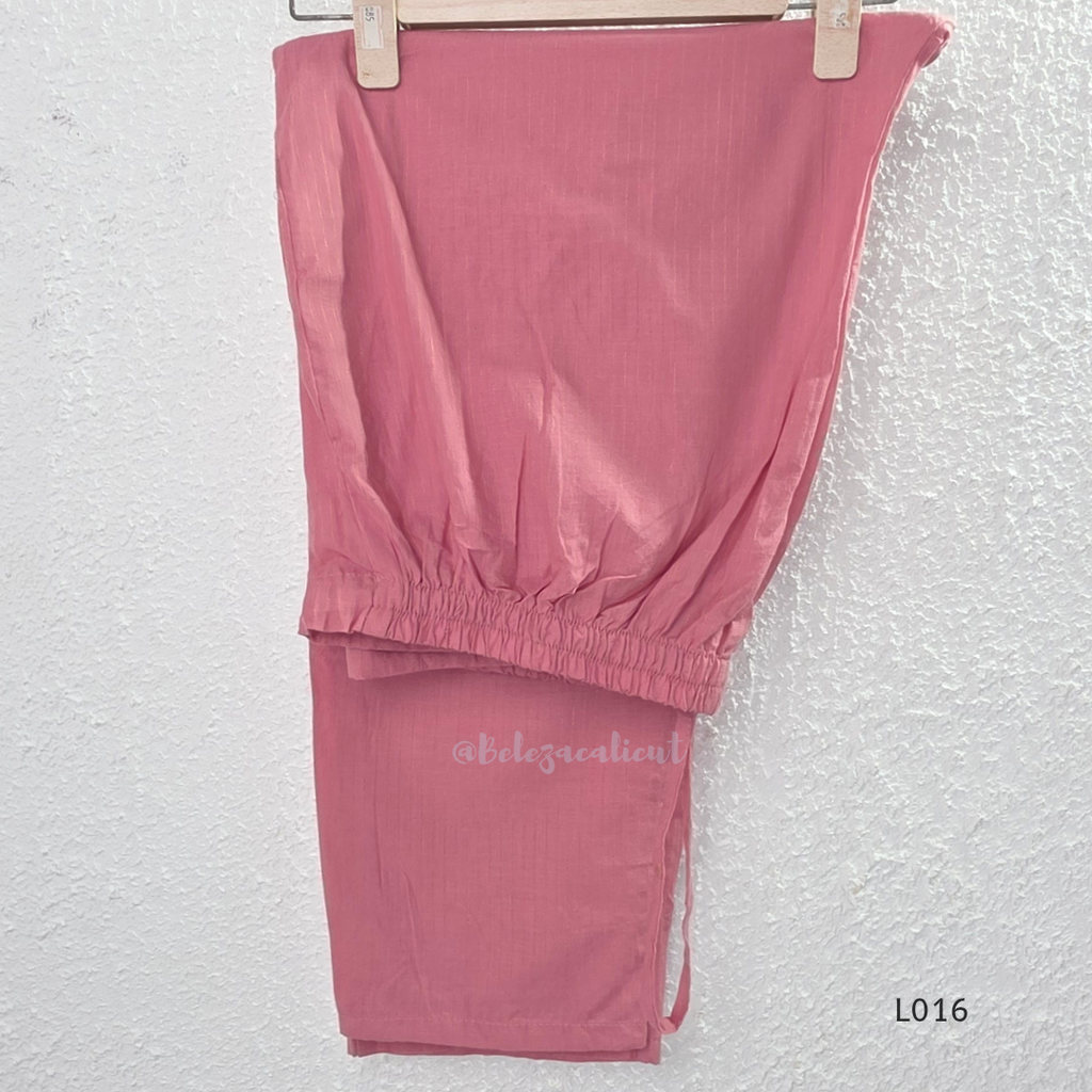 Dusty rose cotton lined 3-piece ethnic set with V-neck pintuck yoke, matching pant and textured tassel dupatta.