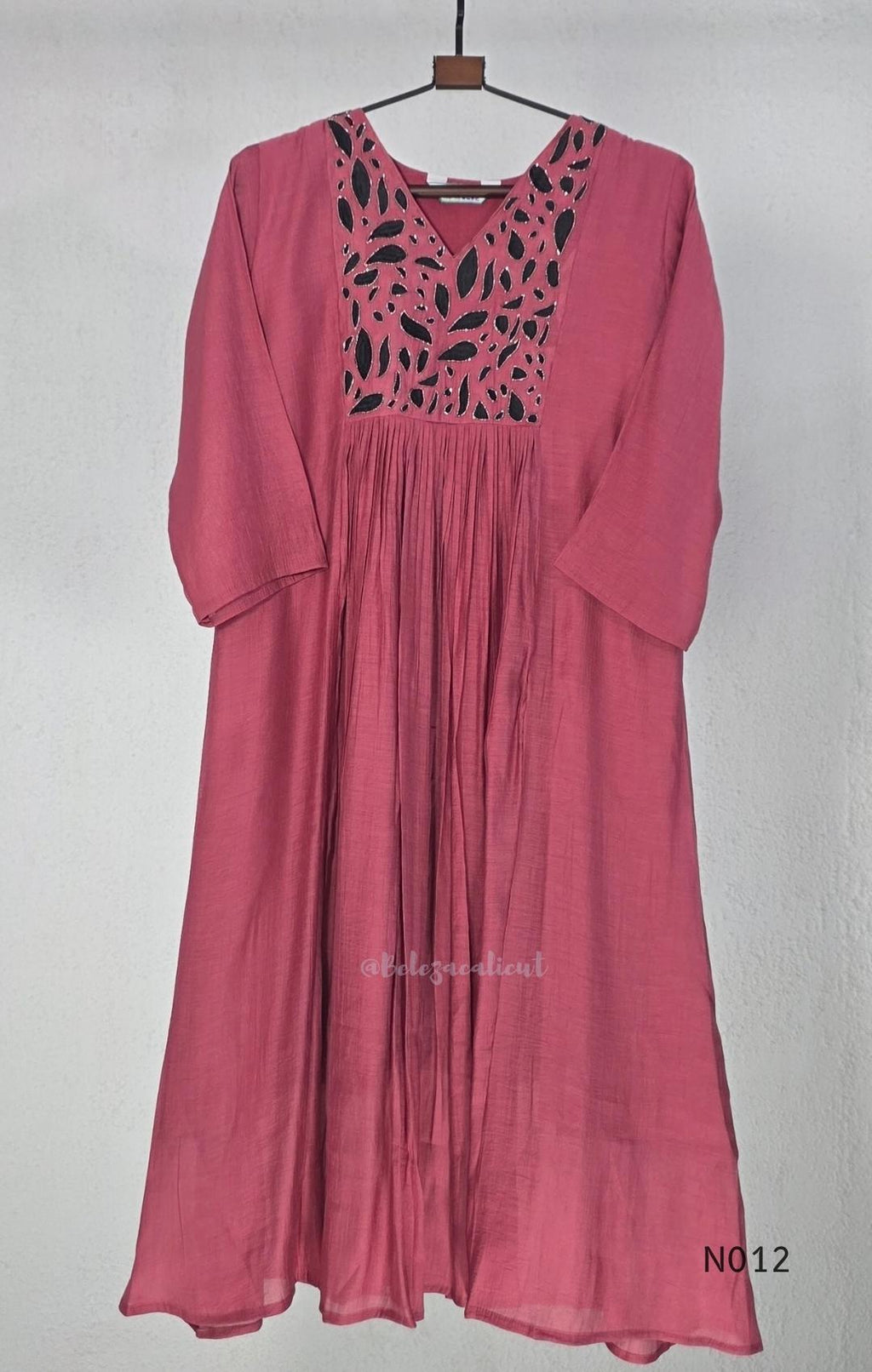 Dusty rose pink Mul Chanderi full churidar set with black leaf-shaped neckline work, matching straight pants and chiffon dupatta.